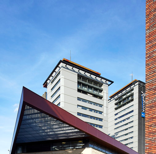 De torens van de TT-wijk kenmerken de skyline van Hasselt
